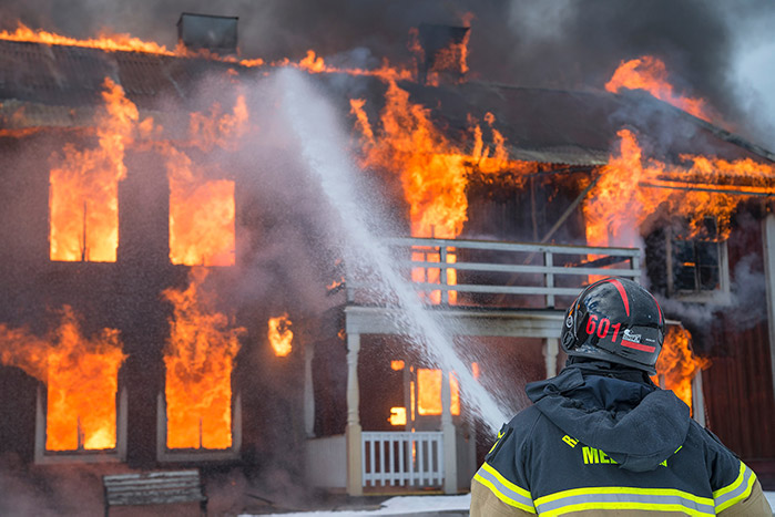 man fighting fire in safety gear